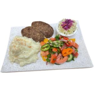 Beef cutlets with mashed potatoes and sides