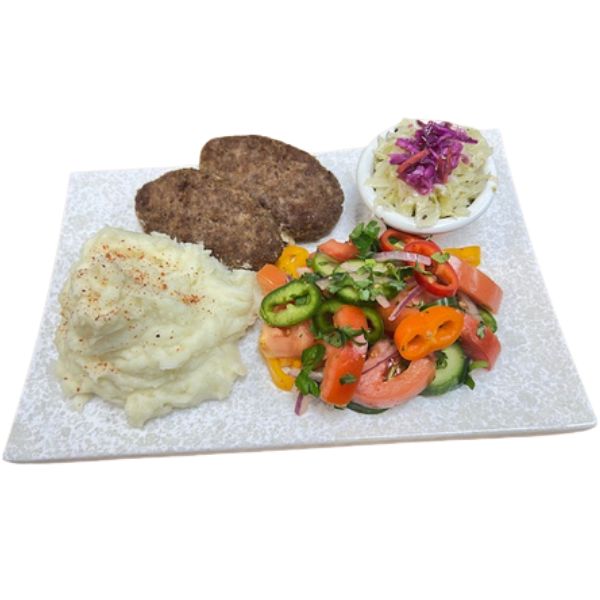 Beef cutlets with mashed potatoes and sides