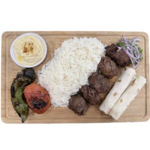 Grilled beef kabob plate with rice and grilled vegetables