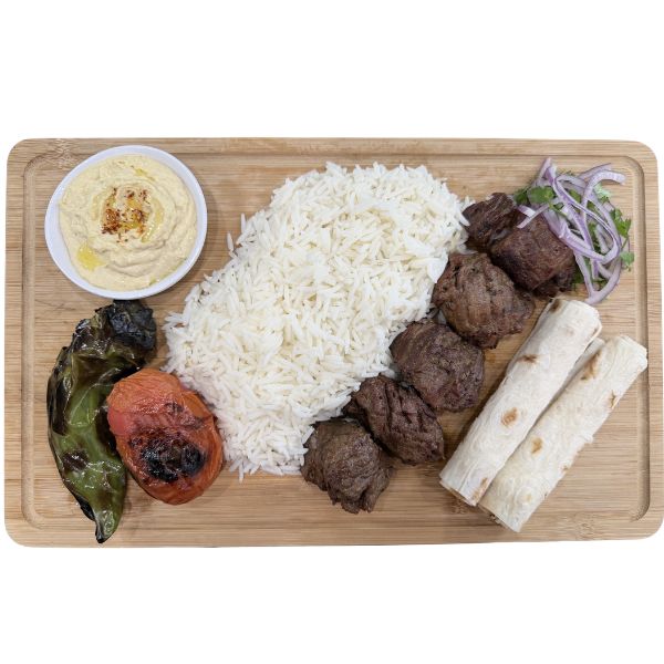 Grilled beef kabob plate with rice and grilled vegetables