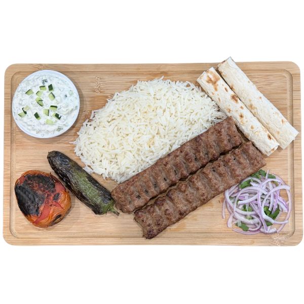 Beef lula kabob plate with rice and grilled vegetables
