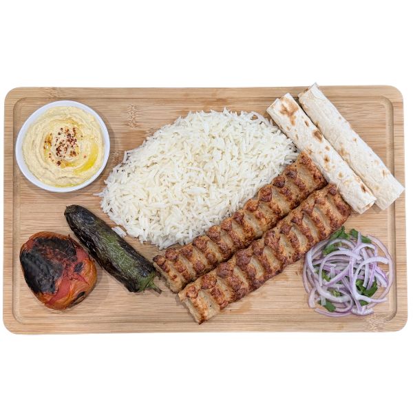 Chicken lula kabob plate with rice and grilled vegetables