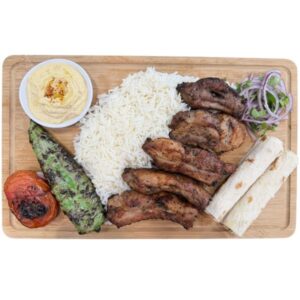 Grilled pork ribs plate with rice and vegetables